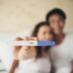 excited new parent hand show pregnancy test 1150 5090