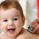 pediatrician doctor examines pediatrician ss FEATURE e1537975437997