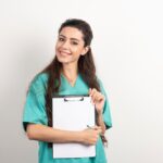 Unlock Your Future: Diploma in Nursing Care Assistant in Agra 20 young female medical employee holding medical records 114579 64289 1