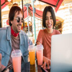 portrait smiling young woman drinking glasses restaurant table 1048944 5566280