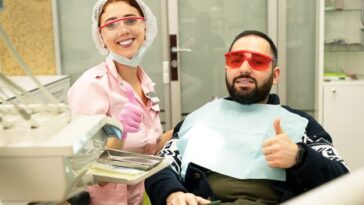 young female dentist doctor patient smiling camera dental clinic 100894 590