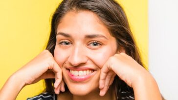 brunette girl posing with striped t shirt 23 2148136172