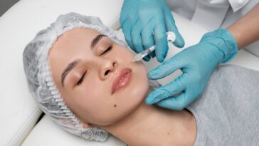 high angle woman getting injection clinic 23 2149341877