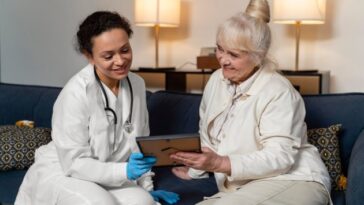 senior woman showing her doctor photo frame 23 2148962335 1