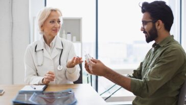 senior female therapist consulting young patient checkup meeting hospital 161094 23315