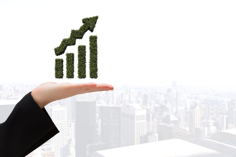 graphic hand with city backgroun