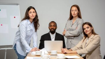 young people talking working videoconference with colleagues office living room min 2 2