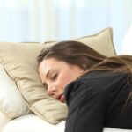 woman asleep on couch 1280x640 1