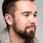 side view handsome man smiling 23 2148696667