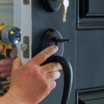 How Locksmith Services in Orlando, FL Can Improve Your Home Security 20 closeup of a professional locksmith installing a new lock on a house exterior door with the inside qvjbg0v2gfxtrll1jz4zsmwqmp4r4s5vxuq0io2eio