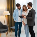 How to Choose the Right Coventry Estate Agent 21 male real estate agent doing business showing house potential buying couple 23 2150164710 1