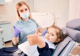 female dentist cute little girl giving thumbs up 651396 2220
