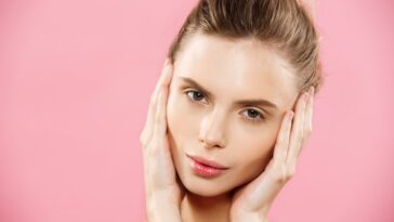 beauty concept beautiful caucasian woman with clean skin natural make up isolated bright pink background with copy space 1258 1089