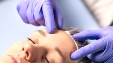 cosmetologist plastic surgeon or doctor with patient or customer consultation and plan before 1